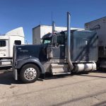 dirty semi truck with blue cab